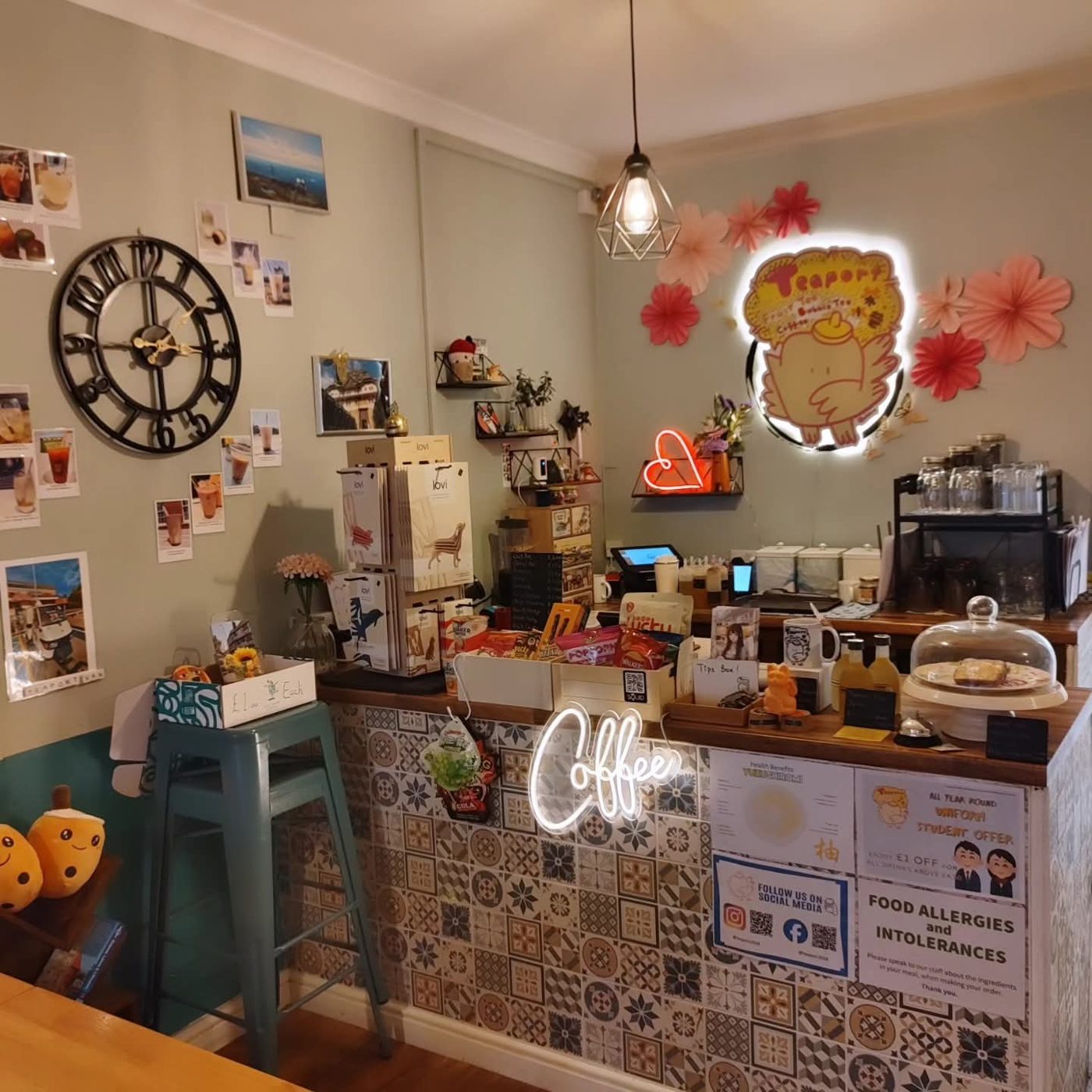 The counter with a wall clock and framed pictures